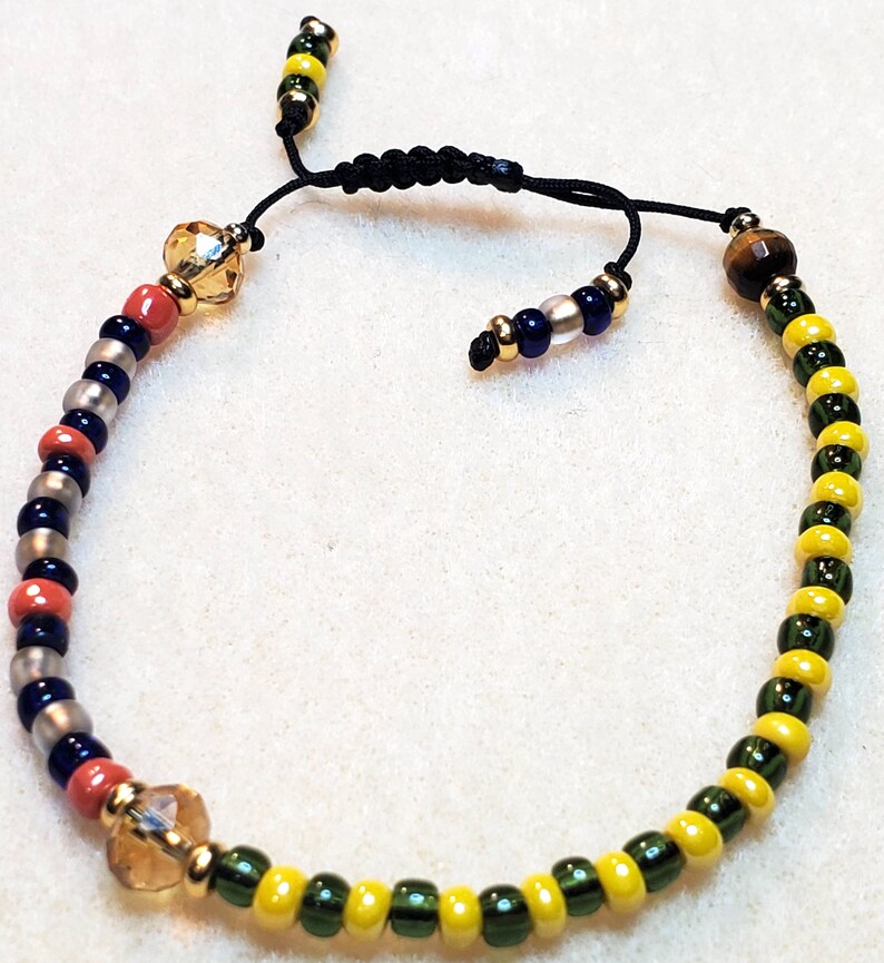 Sintético 101+ Foto Que Significa La Pulsera De Orula Mirada Tensa