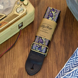 New Limited Edition HipStrap Purpleheart vintage style guitar strap. Jacquard woven design, leather ends, metal hardware. Woodstock