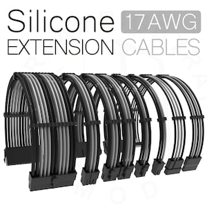 Puede incluir: Un conjunto de cables de extensión de silicona 17 AWG negros y grises. Los cables están trenzados y tienen un conector negro en un extremo y un conector gris en el otro extremo.  Cables de extensión de silicona 17 AWG