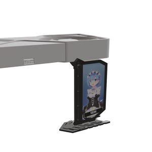May include: A gray and black computer component with a graphic of an anime character. The graphic features a blue-haired girl wearing a maid outfit. The text "REM" is visible on the graphic.