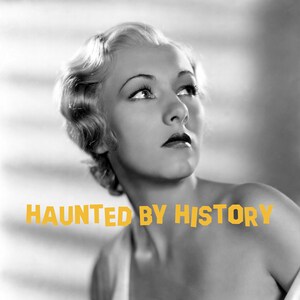 May include: Black and white portrait of a woman with short, wavy hair. She is wearing a low-cut, lace-trimmed dress and a sheer shawl. The text "HAUNTED BY HISTORY" is superimposed over the image.