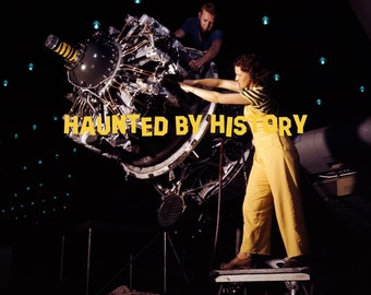 May include: A woman in yellow overalls works on a large, black airplane engine. The engine is mounted on a stand and has many wires and pipes attached to it. The text "HAUNTED BY HISTORY" is superimposed on the image.