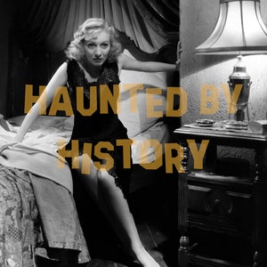May include: A black and white photograph featuring a person in a dark lace-trimmed slip dress sitting on a bed with a canopy, next to a wooden nightstand with a lamp. The text HAUNTED BY HISTORY is overlaid in gold across the centre of the image.