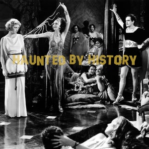 May include: A black and white photo of a group of people in a theatrical setting. The people are dressed in costumes and are posing for a photo. The photo is titled "Haunted by History".