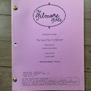 May include: A lavender-colored television shooting script for The Gilmore Girls, episode The Road Trip To Harvard, written by Daniel Palladino and directed by Jamie Babbit, dated 8/27/01, featuring two brass fasteners on the left side of the page.