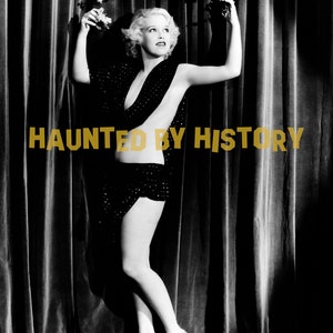 May include: A black and white photo of a woman wearing a black sequined dress and high heels. She is standing in front of a velvet curtain with a floral crown on her head. The text "HAUNTED BY HISTORY" is superimposed on the image.