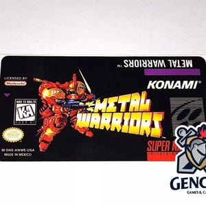 May include: A black Super Nintendo game cartridge label with a red and yellow robot character. The label reads "Metal Warriors" and "Konami".
