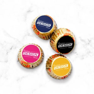 May include: Four chocolate candies wrapped in gold foil with different colored labels. Each label has the text "Custom DESIGN Here" in white.