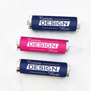 May include: Three individually wrapped chocolate candies with silver foil wrappers. The wrappers have a blue and pink background with the text "Custom DESIGN Here" printed in white.
