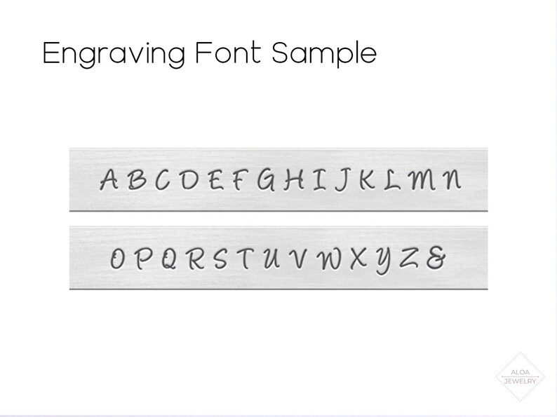 May include: Engraving font sample showing the alphabet in uppercase letters A through Z and the ampersand symbol. The font is a cursive script style.