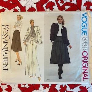 May include: A vintage sewing pattern for a skirt and trousers. The pattern is from Vogue Paris Original and features a design by Yves Saint Laurent. The pattern number is 1761.