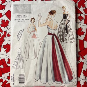 May include: Vintage sewing pattern for a strapless gown with a full skirt and a red sash. The pattern is from 1950 and includes instructions for making the dress.