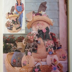 May include: A sewing pattern for making a bunny rabbit doll. The pattern is called "Luv 'N Stuff" and is from Butterick. The pattern number is 5970. The pattern includes instructions for making a large bunny doll, a smaller bunny doll, and a bunny doll in a pram.