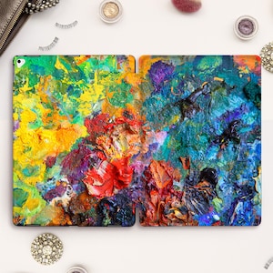 Peut inclure: Une peinture abstraite colorée d'une palette avec différentes nuances de bleu, vert, jaune, rouge et orange. La peinture est épaisse et texturée, créant un effet dynamique et artistique.