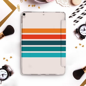 May include: A clear case for an iPad with a colorful striped design. The case has a white background with horizontal stripes in orange, red, teal, and turquoise.