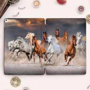 May include: A digital tablet case featuring a colorful image of a herd of horses running through a dusty field under a dramatic cloudy sky.