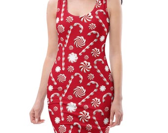 May include: A sleeveless tank dress featuring a vibrant red background with a repeating pattern of white and red striped candy canes and white peppermint swirl candies distributed across the entire surface of the garment.