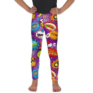 May include: Purple leggings with a colorful comic book print featuring words like "Bang", "Pow", and "Wow".
