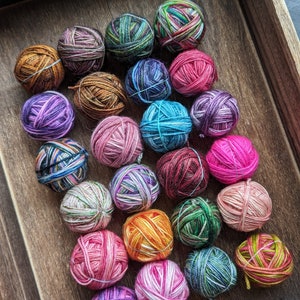 Dragon Eggs, 5 and 10 gram wound balls of fingering weight yarn, super wash merino and nylon