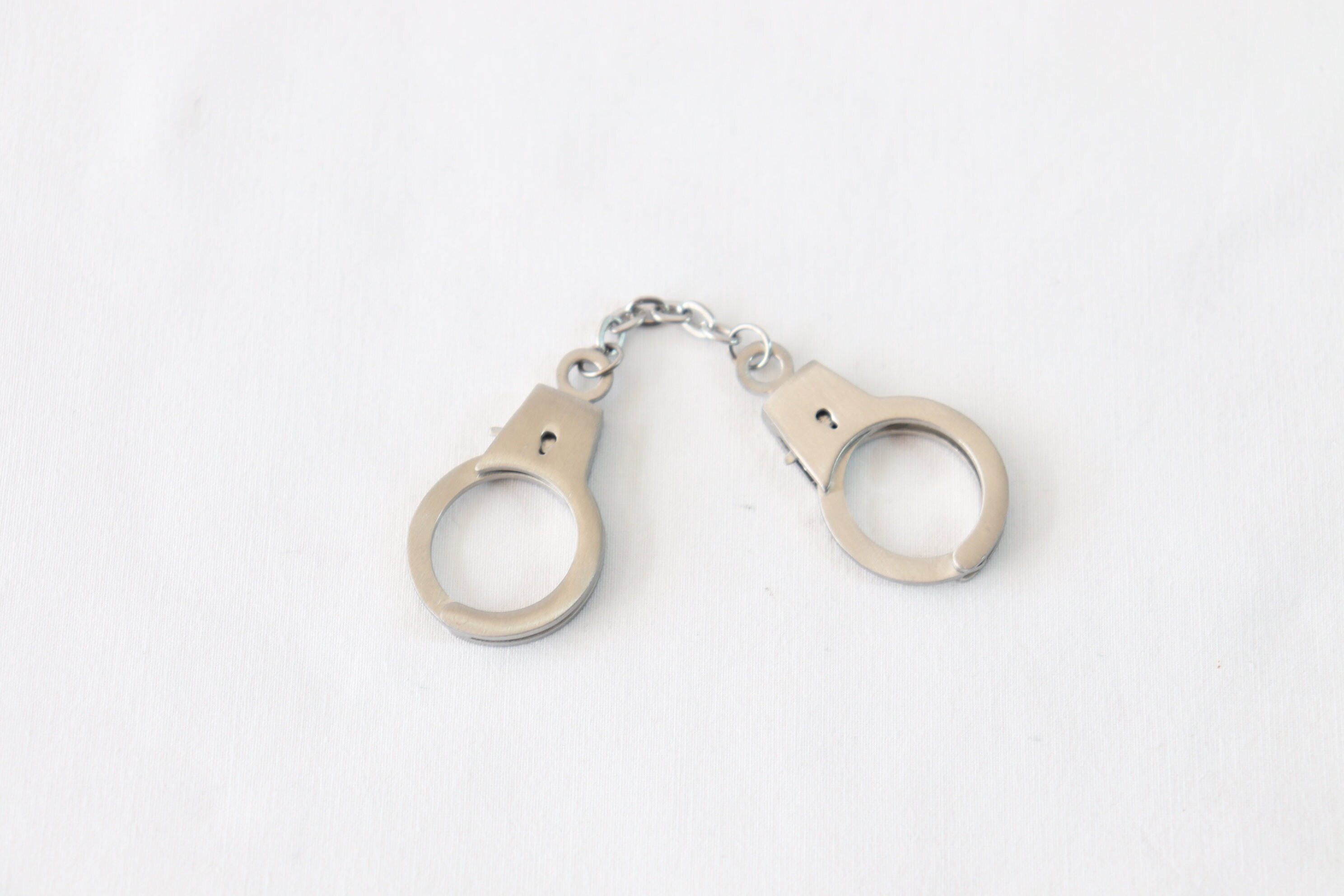 Pink handcuff shop keychain