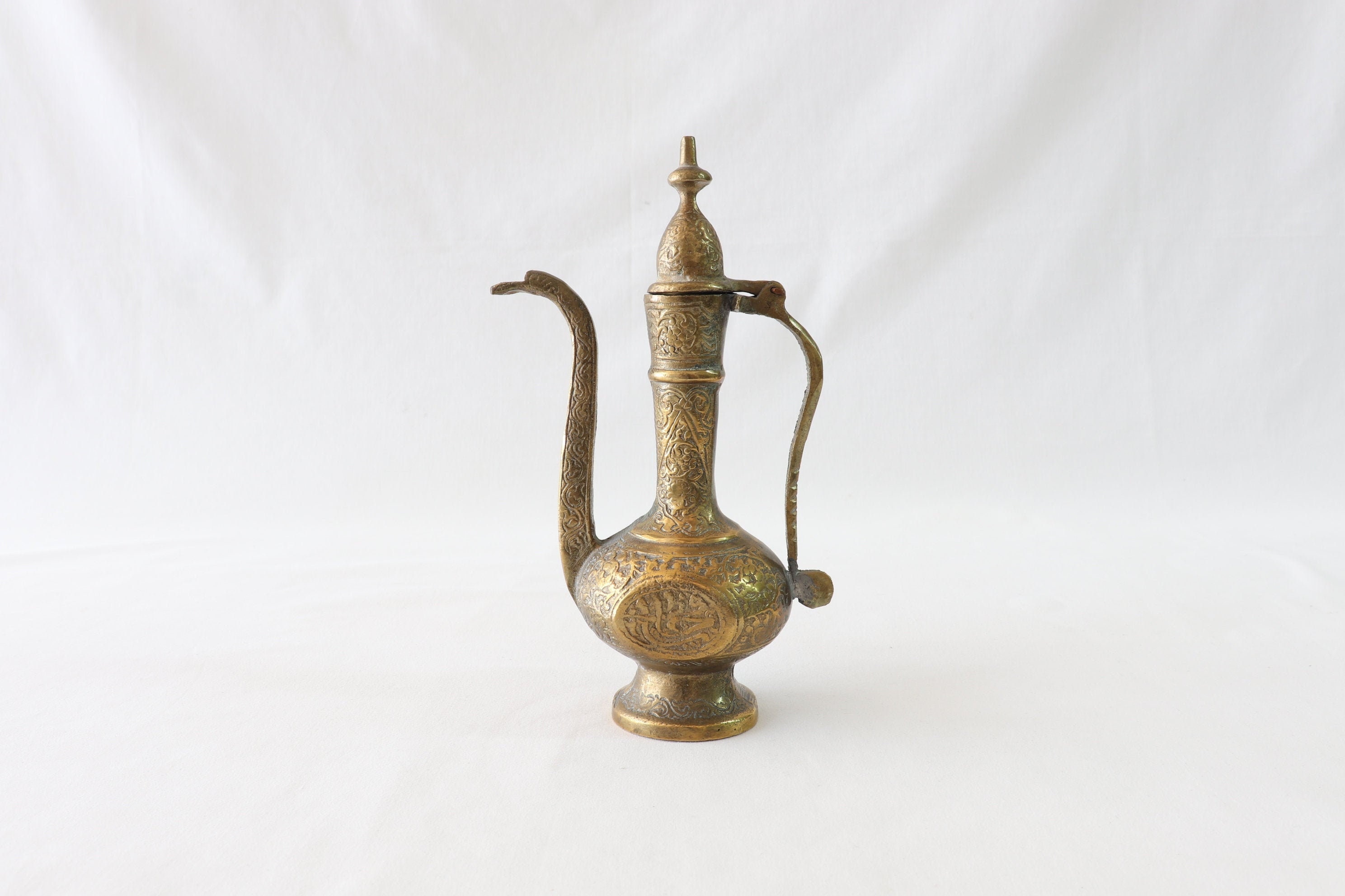 Antique brass water pitcher