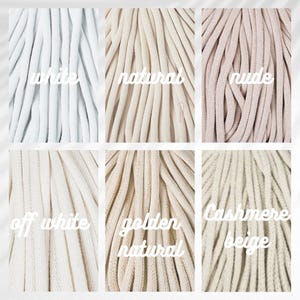 May include: Close-up of six different colored macrame cords. The colors include white, natural, nude, off white, golden natural, and cashmere beige. Each color is labeled with its name in a white, handwritten font.