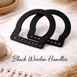 May include: Two black wooden handles with a rounded top and a rectangular base with multiple holes. The handles are arranged on a light-colored surface with the text "Black Wooden Handles" in a script font.