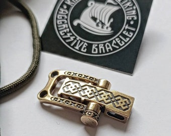 Bracelet lock. Paracord Buckles, U-shaped buckle. Viking-style paracord beads.  Viking jewelry, manual casting. Scandinavian symbol.