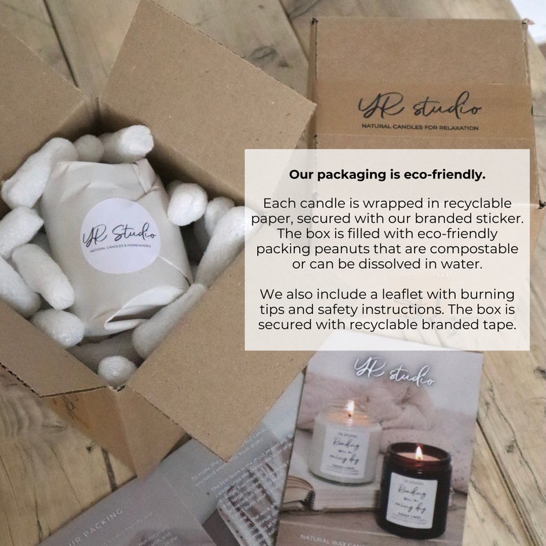 May include: A white box with a candle inside, surrounded by packing peanuts. The box is labelled "YR Studio" and the text "Our packaging is eco-friendly." is visible. The text explains that the candle is wrapped in recyclable paper, secured with a branded sticker, and the box is filled with eco-friendly packing peanuts that are compostable or can be dissolved in water. The box is secured with recyclable branded tape.
