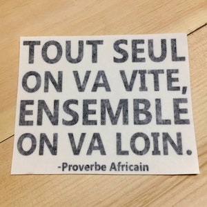 May include: A white card with black text that reads "Tout seul on va vite, ensemble on va loin."  The text is a French proverb that translates to "Alone we go fast, together we go far."  The card also includes the text "Proverbe Africain" at the bottom.