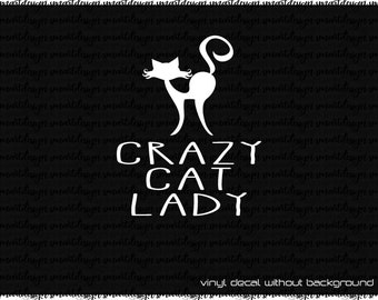 May include: A white vinyl decal featuring a stylized silhouette of a cat with an arched back and a curled tail, positioned above the text CRAZY CAT LADY in a bold, sans-serif font. The design is presented against a dark background.