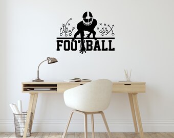May include: Black and white silhouette of a football player in a three-point stance with the word "FOOTBALL" below. The player is surrounded by football play diagrams.