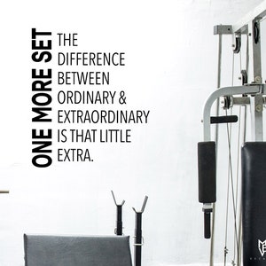 May include: Black and white motivational quote on a white wall, "One more set. The difference between ordinary & extraordinary is that little extra."