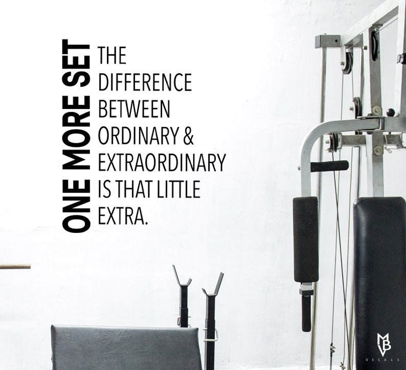 May include: Black and white motivational quote on a white wall, "One more set. The difference between ordinary & extraordinary is that little extra."
