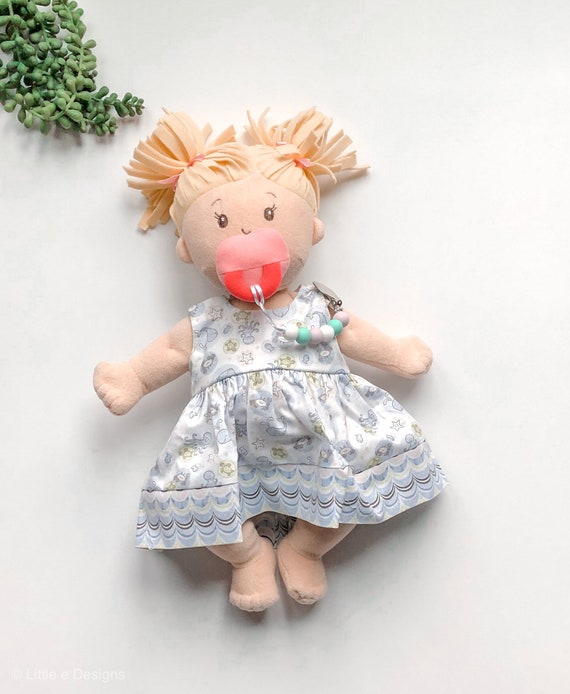 baby doll with pacifier