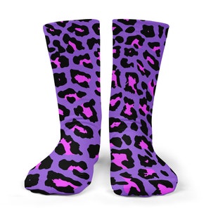 May include: A pair of purple and pink leopard print socks. The socks are made of a soft, comfortable material and are perfect for everyday wear.