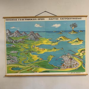 May include: Vintage Greek geography map with a detailed illustration of a coastal region, featuring mountains, islands, and a volcano. The map is in shades of blue, green, and brown, with text in Greek. The map is mounted on wooden rods.