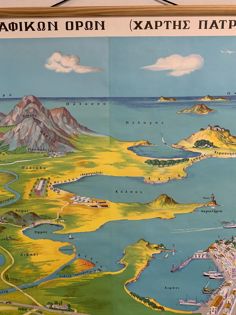 May include: Vintage map print featuring a detailed, illustrated depiction of a coastal region. The map showcases mountains, islands, and a coastline with a harbor, rendered in a palette of blues, greens, and yellows. Text in Greek is visible at the top.