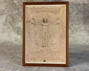El Hombre de Vitruvio, lámina de Da Vinci: boceto a pluma y tinta, enmarcado.