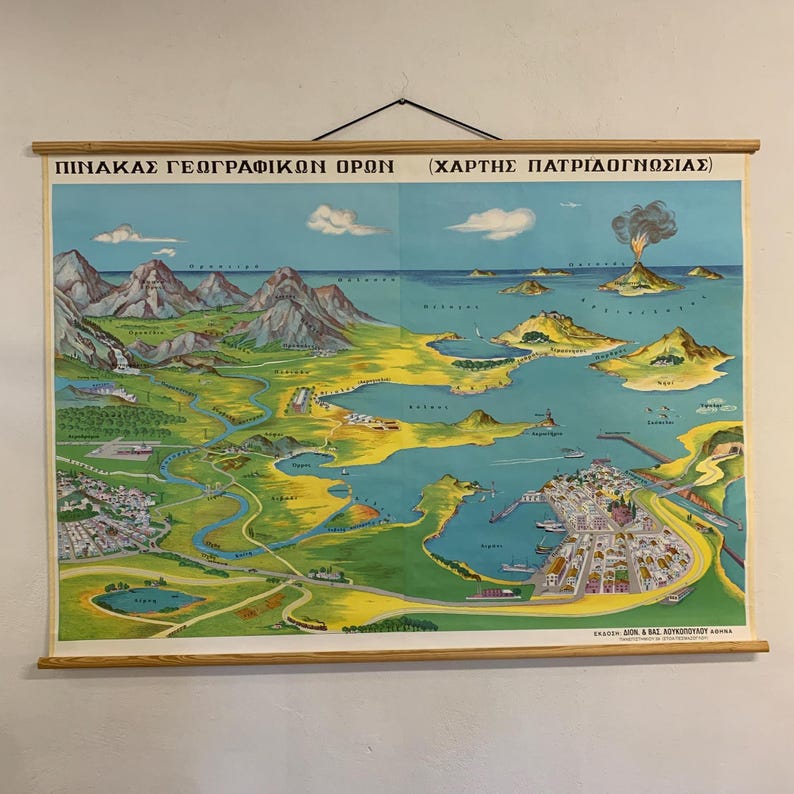 May include: A vintage map print with a wooden frame, depicting a colorful landscape with mountains, islands, and a volcano. The map features Greek text at the top and is mounted on a wooden rod for hanging. The color palette includes shades of blue, green, yellow, and brown.