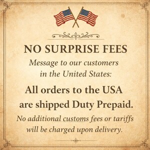 May include: A vintage-style sign with a cream-colored background and decorative borders. The text reads "NO SURPRISE FEES" and a message to customers in the United States about duty-prepaid shipping. Two American flags are at the top.