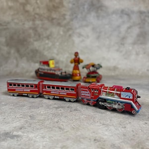 Tin vintage train, battery operated toy train with classic design, collectible decor and nostalgic play, perfect gift for train lovers