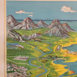 May include: Vintage Greek geographical map poster with text in Greek. The map depicts mountains, rivers, and coastal areas in a colorful, illustrated style. The poster is mounted on a wooden rod for hanging.