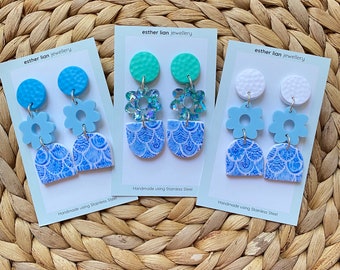 Clay and acrylic drops. Delft mosaic blues with blue/white/turquoise/glitter. Lift your outfit and start a conversation with these earrings!