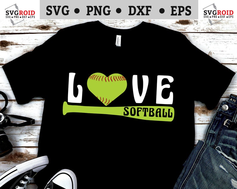 May include: Black t-shirt with the text "LOVE SOFTBALL" in white letters. A green softball bat is under the text. A green softball with red stitching is in the shape of a heart.