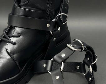 Pair of black leather boot straps