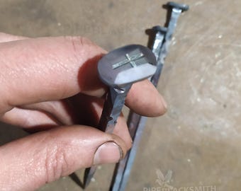 Rectangular head nail with cross, forged iron, black Iron, with barbs