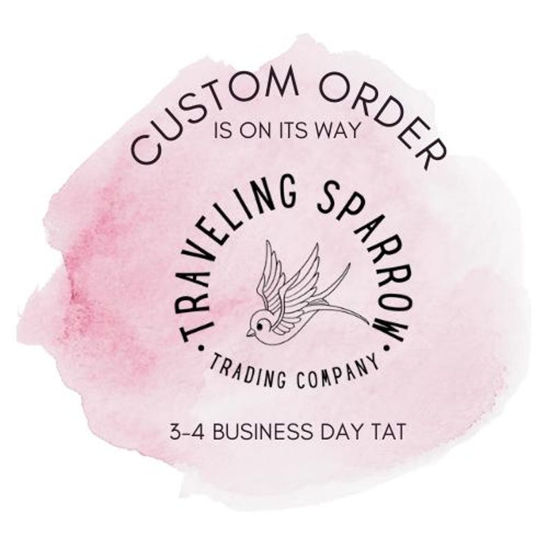 May include: A pink watercolor background with the text "CUSTOM ORDER IS ON ITS WAY" in a circle. Below the circle is the text "TRAVELLING SPARROW TRADING COMPANY" in a circle with a stylized sparrow illustration. The text "3-4 BUSINESS DAY TAT" is below the circle.