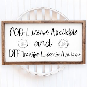 May include: A rectangular wooden sign with the text "POD License Available and DTF Transfer License Available" in black script. The sign includes the "Traveling Sparrow Trading Company" logo. The sign is set against a white background.