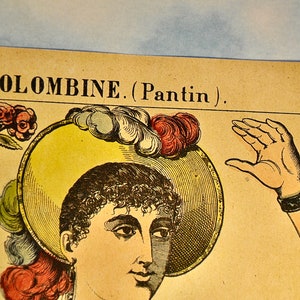 May include: A vintage-style paper print titled COLOMBINE. (Pantin) featuring a detailed illustration of a person wearing a wide-brimmed yellow hat adorned with red and white feathers. The figure holds a small stem with two red roses in one hand.